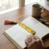 madhubani floral bookmark in use, aesthetic bookmark for gifting