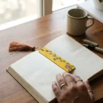madhubani floral bookmark in use, aesthetic bookmark for gifting
