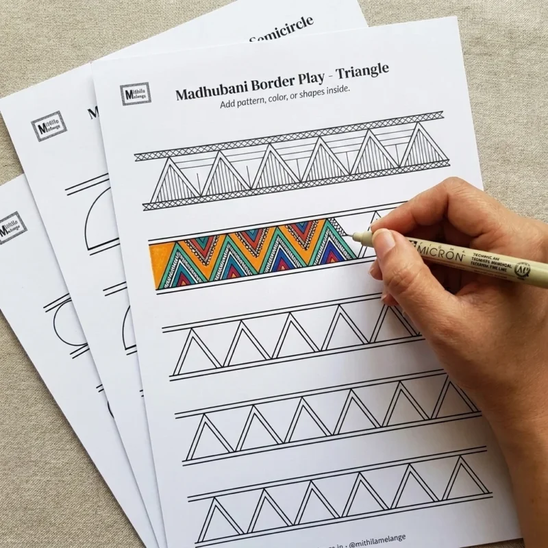 madhubani border design practice pages being filled