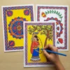 madhubani mandala coloring sheets being colored